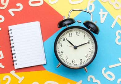 alarm clock lying on multicolored surface